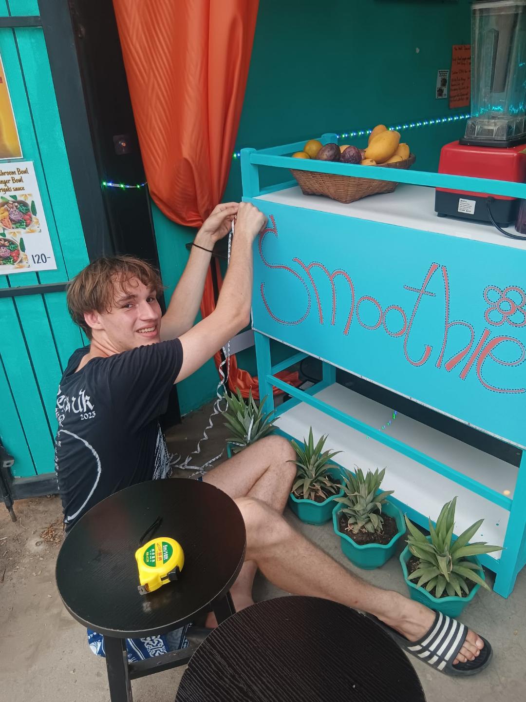 Volunteer setting up the smoothie bar at Aurora — Aurora, a top restaurant in Pai (healthy Pai restaurant, health-focused)
