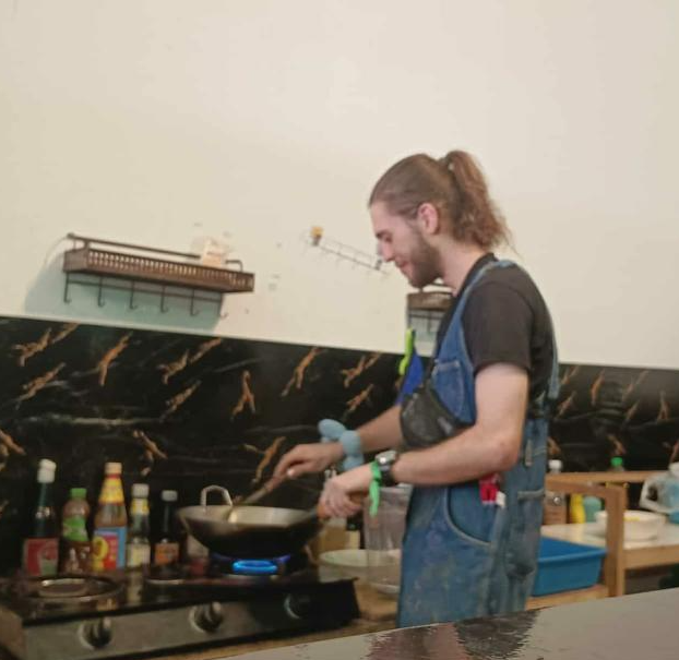 Volunteer cooking in the Aurora kitchen with Sarah — Aurora, a top restaurant in Pai (healthy Pai restaurant, health-focused)
