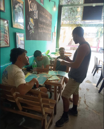 Volunteers chatting with friends at Aurora — Aurora, a top restaurant in Pai (healthy Pai restaurant, health-focused)